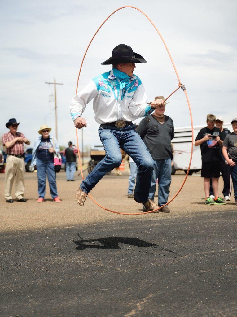 Cowboy uses a lasso stunt during an event at the Folk Festival. 