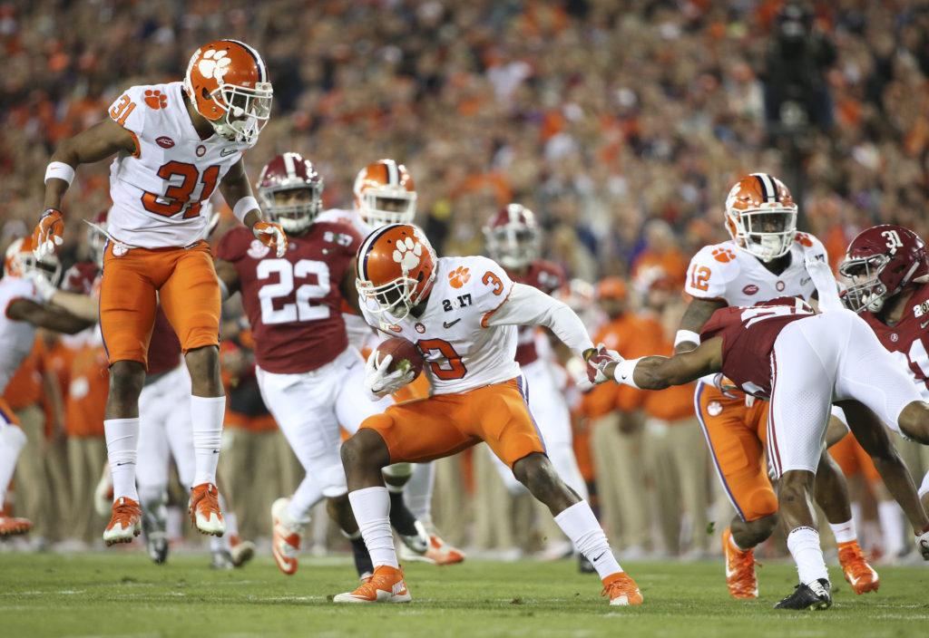 Clemson Tigers wide receiver Artavis Scott (3) runs the ball as Clemson Tigers safety Kyle Cote (32) looks on during the first quarter against the Alabama Crimson Tide during the College Football Playoff National Championship on Monday, Jan. 9, 2017 at Raymond James Stadium in Tampa, Fla. (Loren Elliott/Tampa Bay Times/TNS)