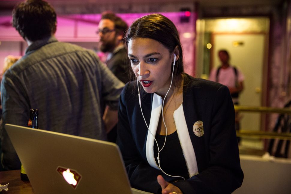 NEW YORK, NY - JUNE 26: Progressive challenger Alexandria Ocasio-Cortez celebrartes  at a victory party in the Bronx after upsetting incumbent Democratic Representative Joseph Crowly on June 26, 2018 in New York City.  Ocasio-Cortez upset Rep. Joseph Crowley in New York’s 14th Congressional District, which includes parts of the Bronx and Queens. (Photo by Scott Heins/Getty Images)