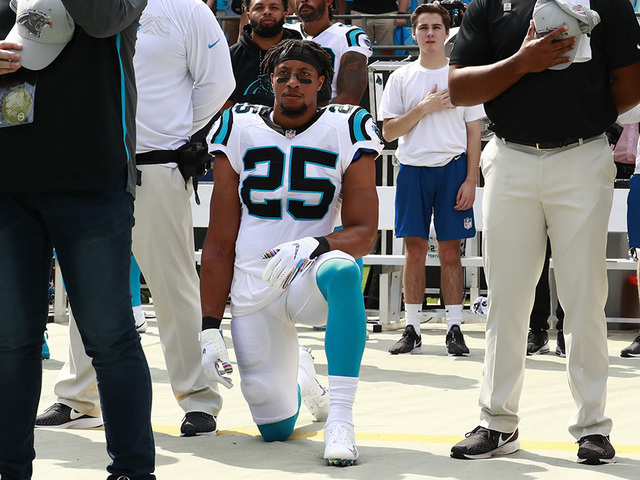 Carolina Panthers Eric Reid (25) kneels as Cam Newton (1) stands during the national anthem before an NFL football game against the New York Giants in Charlotte, N.C., Sunday, Oct. 7, 2018. (AP Photo/Jason E. Miczek)