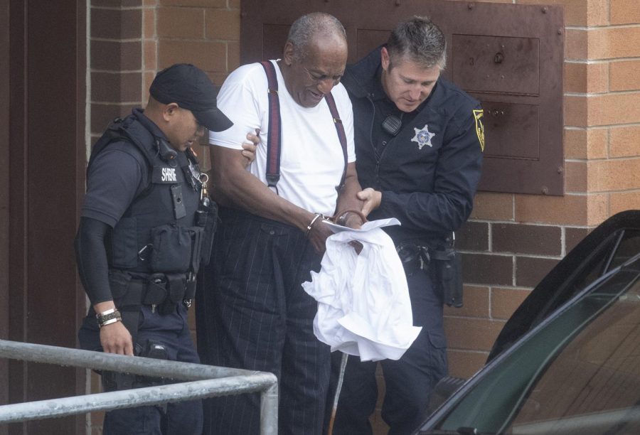 Bill Cosby is escorted by police in handcuffs as he exits the Montgomery County Correctional Facility in Norristown, Pa., on Tuesday, Sept. 26, 2018.