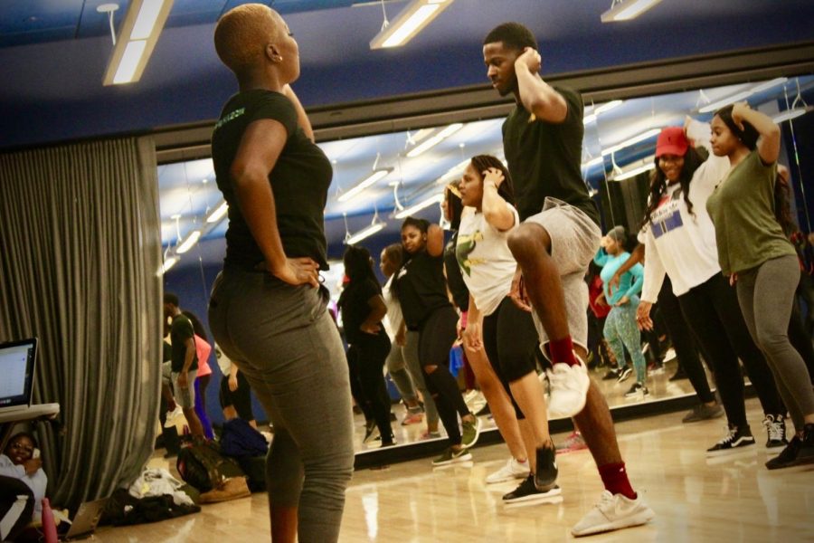 Brown is pictured with students at the Party Pilates program.