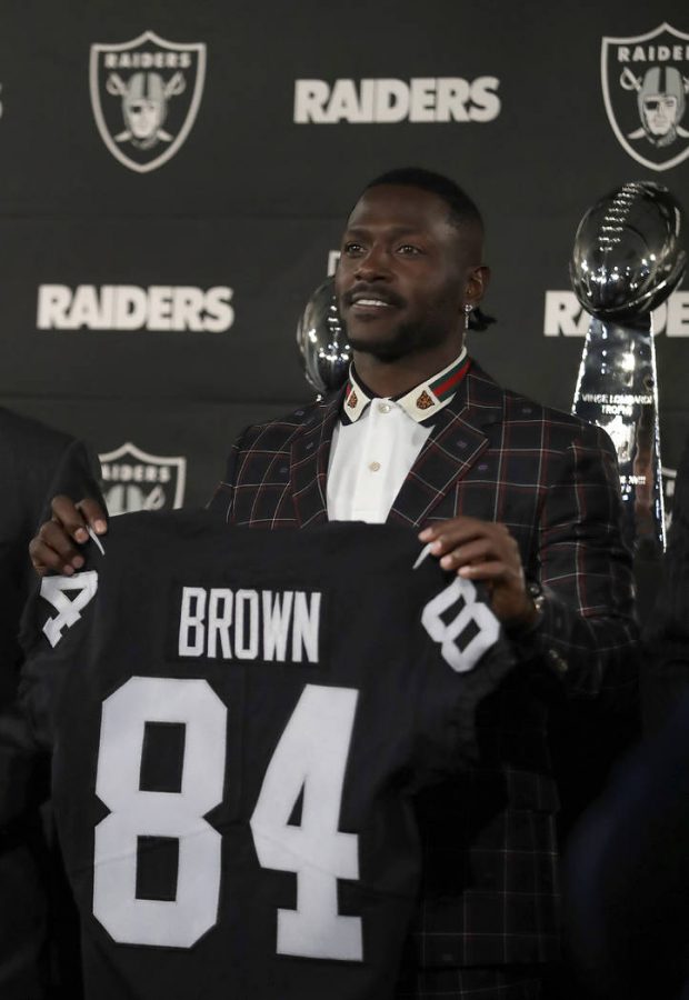AB trades black and yellow for black and silver; joins Oakland