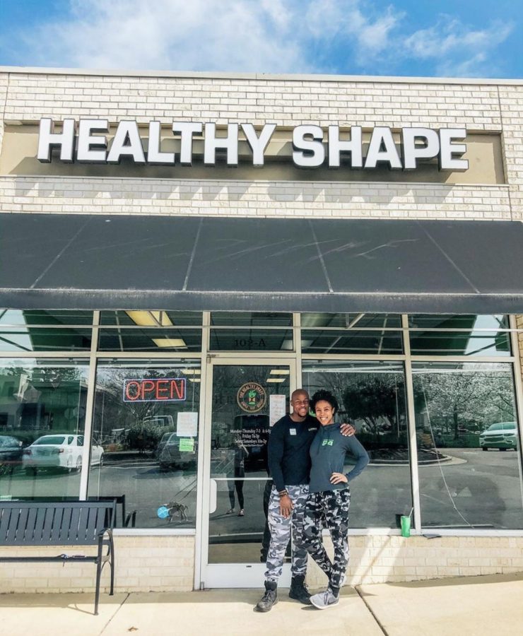 Co-owners Jay and Porscha Wilson in front of their health and wellness business The Healthy Shape. Photo Courtesy of State Street Greensboro on Instagram.