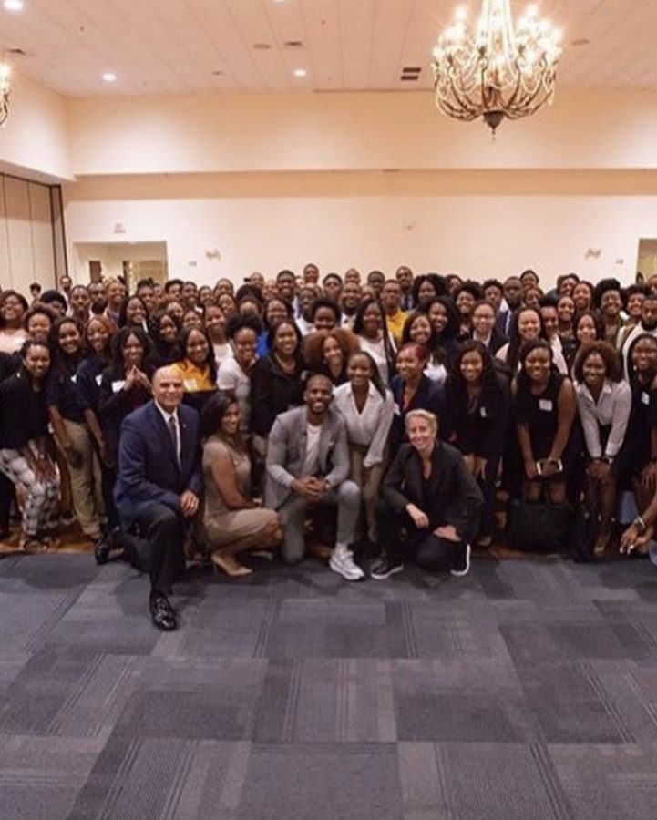 From left to right: Chancellor Dr. Harold L. Martin, Taylor Rooks, CHris Paul, and Anita Elberse take a picture with students and staff during their visit at N.C. A&T.