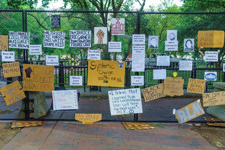 fence-of-posters-at-black-lives-matter-plaza-49991526872