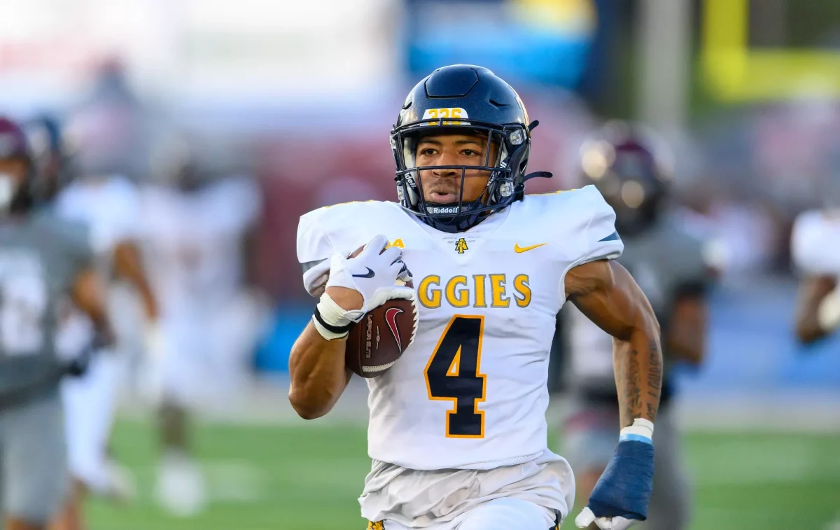 N.C A&T's Aaron Harris returning opening kickoff for a touchdown.