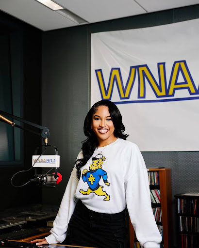 Lady E says her goodbyes to WNAA-FM Radio Station in her graduation photos.