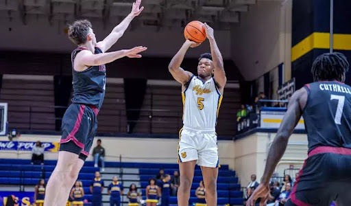 Freshman Forward Lewis Walker attempts a jumpshot vs Elon University