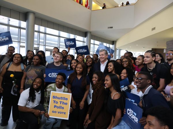 Former Governor Roy Cooper poses with a group of N.C. A&T students in Frye Hall.
