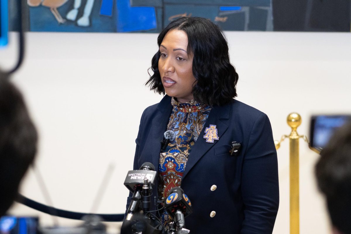 Crystal W. Boyce speaks with reporters following the passing of Rev. Jesse Jackson.